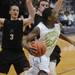 Huron senior Allen Thomas looks to shoot a basket in the second half against Pinckney during a district match up at Pioneer on Wednesday. Melanie Maxwell I AnnArbor.com